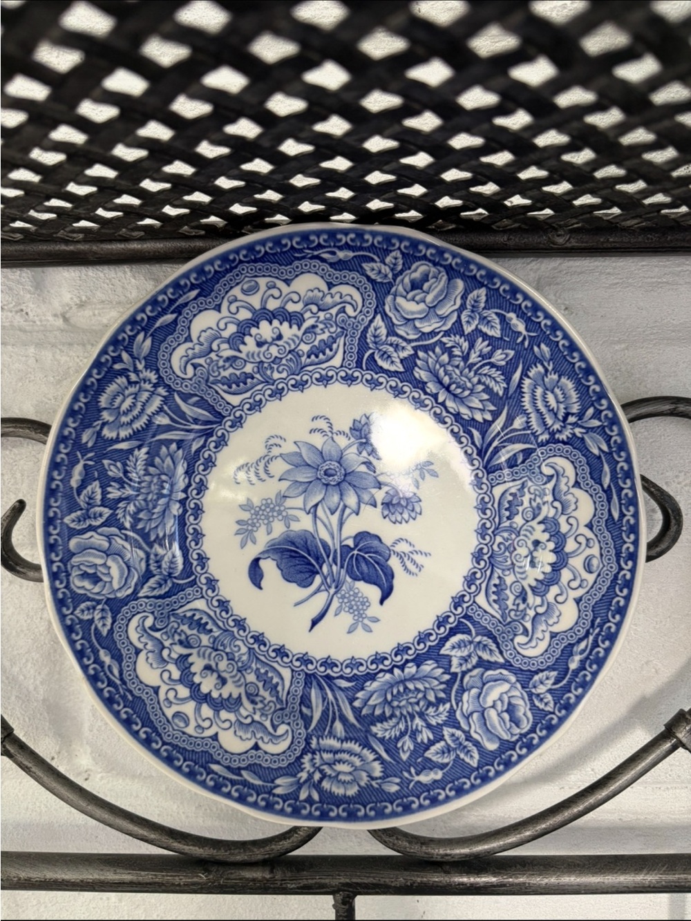 Black Wrought Iron Wall Shelf with Hooks and Decorative Blue Plate - Picture 8 of 12